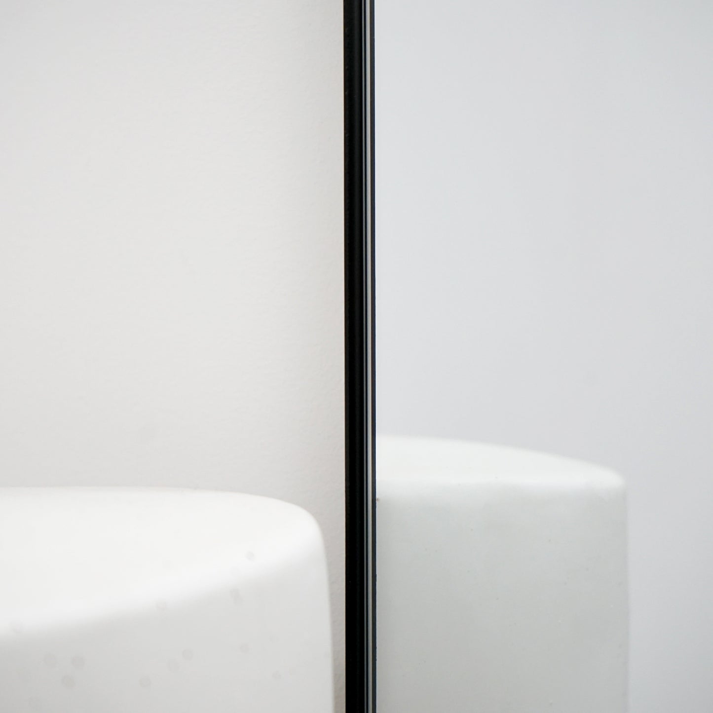 Full length black large metal mirror closeup