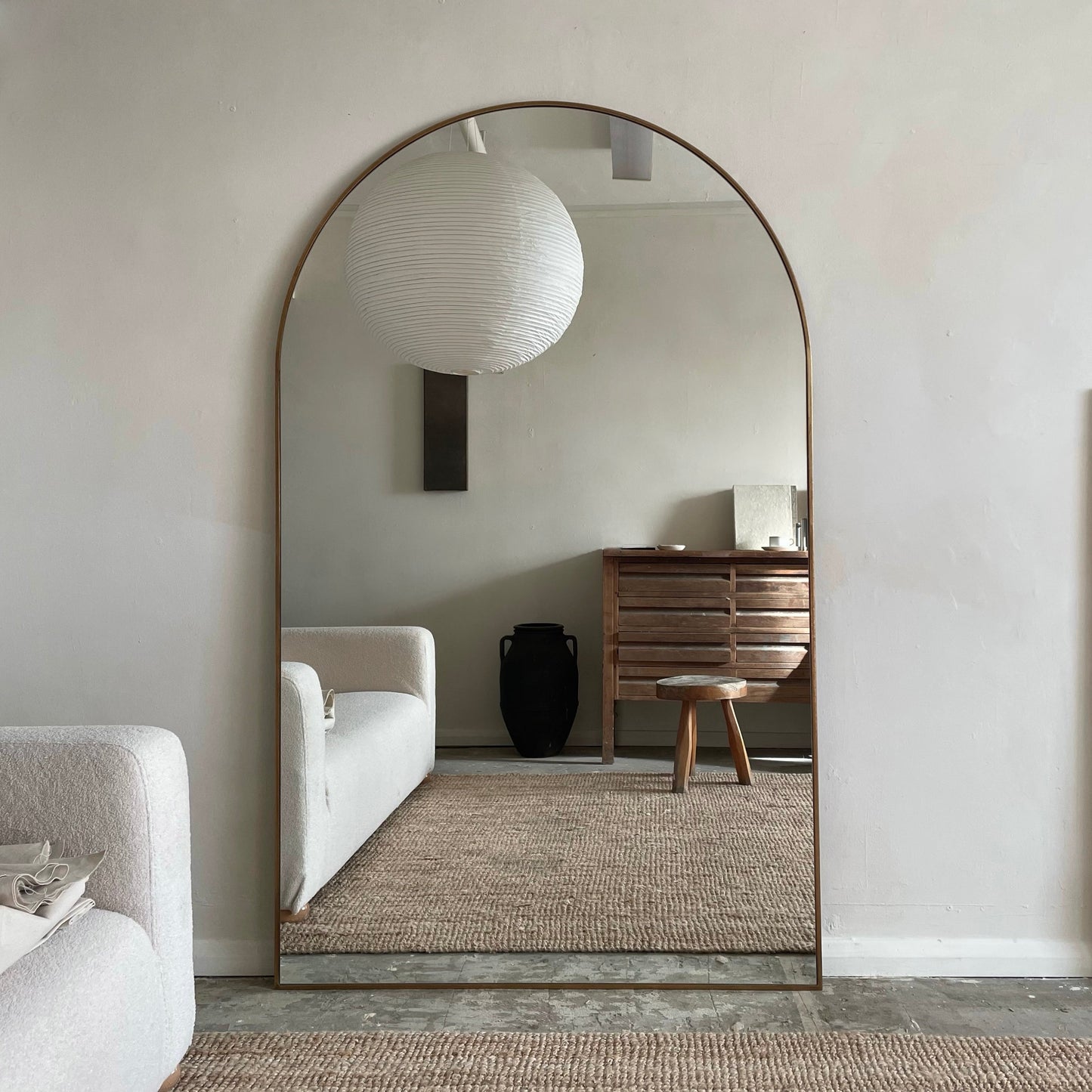 Dourado Full Length Arched Metal Mirror as living room lean to