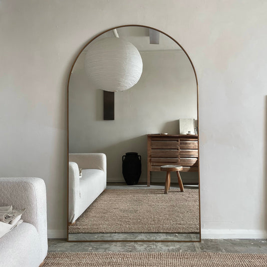 Dourado Full Length Arched Metal Mirror as living room lean to