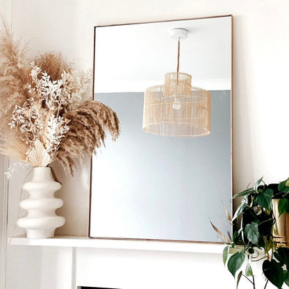 Dourado Rectangular Metal Wall Mirror reflecting chandelier