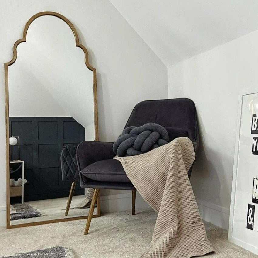 Dourado industrial arched extra large metal mirror leaning against wall